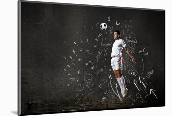 Football Player in Jump Striking Ball with Sketches at Backdrop-Sergey Nivens-Mounted Photographic Print