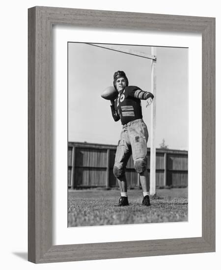 Football Player Throwing Ball-null-Framed Photo