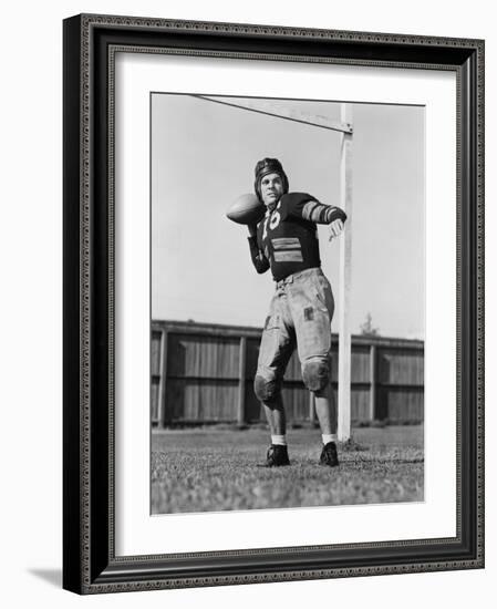 Football Player Throwing Ball-null-Framed Photo