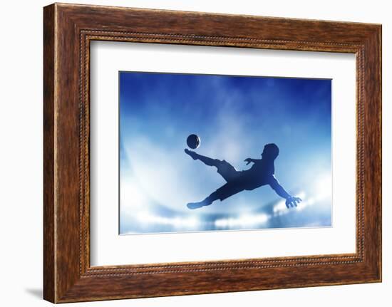 Football, Soccer Match. A Player Shooting on Goal Performing a Bicycle Kick. Lights on the Stadium-Michal Bednarek-Framed Photographic Print