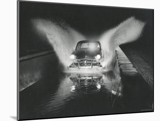 Ford Car Being Driven Through Deep Water at Ford Test Site-Gjon Mili-Mounted Photographic Print