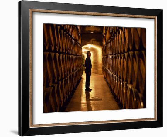 Foreman of Works Inspects Barrels of Rioja Wine in the Underground Cellars at Muga Winery-John Warburton-lee-Framed Photographic Print