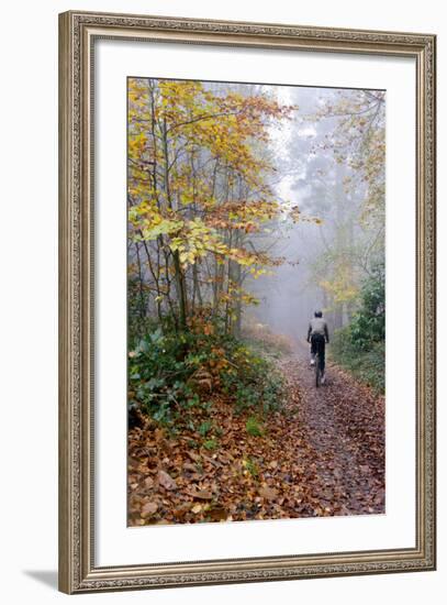 Forest cycling-Charles Bowman-Framed Photographic Print