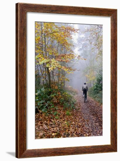 Forest cycling-Charles Bowman-Framed Photographic Print