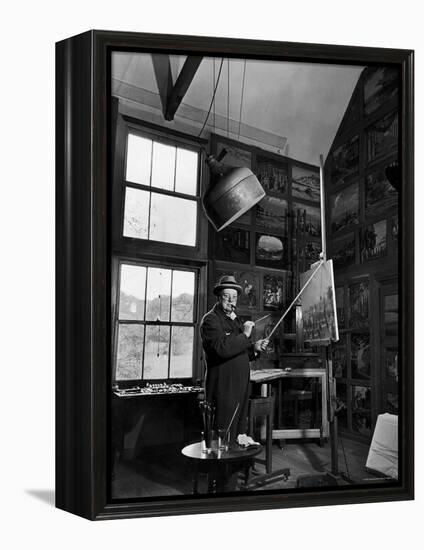 Former PM Winston Churchill Smoking a Cigar in His Studio Dressed in His Blue RAF Siren Jump Suit-Hans Wild-Framed Premier Image Canvas