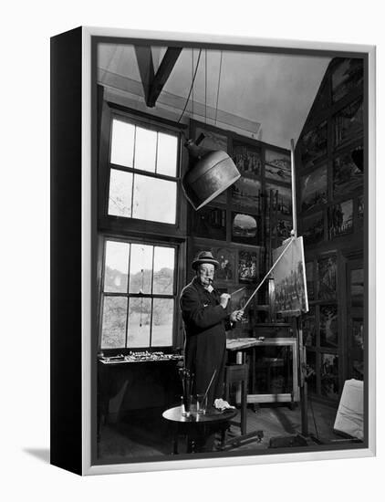 Former PM Winston Churchill Smoking a Cigar in His Studio Dressed in His Blue RAF Siren Jump Suit-Hans Wild-Framed Premier Image Canvas