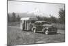Forties Travel Trailer in Mountains-null-Mounted Art Print
