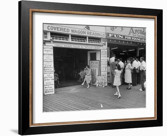 Fortune Teller Booth Next to a Penny Arcade on the Boardwalk in the Resort and Convention City-Alfred Eisenstaedt-Framed Photographic Print