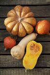 Pumpkin, Butternut- and Hokkaido Squashes on Wooden Background-Fotos mit Geschmack-Framed Photographic Print