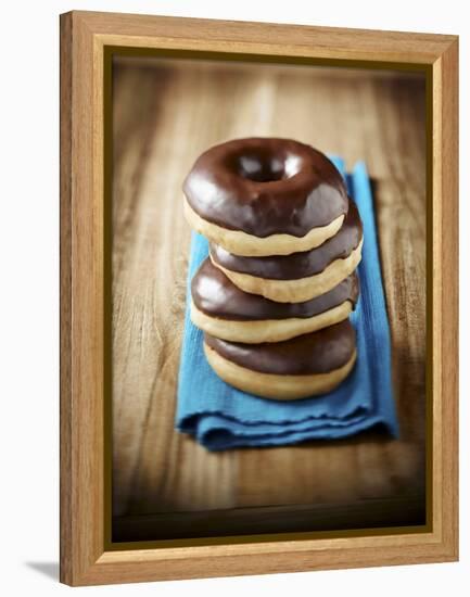 Four Doughnuts with Chocolate Glaze, Stacked-Michael Löffler-Framed Premier Image Canvas
