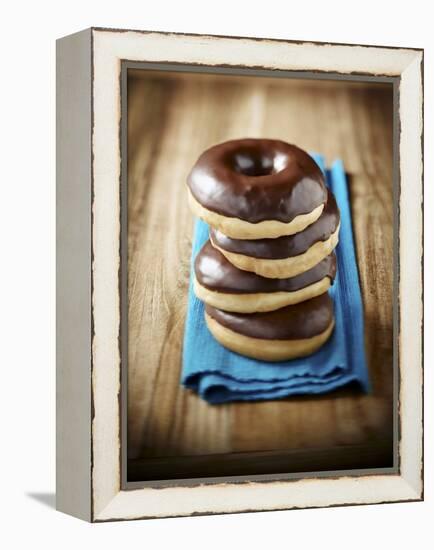 Four Doughnuts with Chocolate Glaze, Stacked-Michael Löffler-Framed Premier Image Canvas