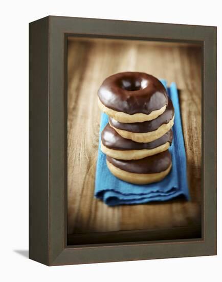 Four Doughnuts with Chocolate Glaze, Stacked-Michael Löffler-Framed Premier Image Canvas