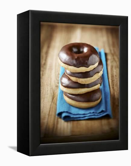 Four Doughnuts with Chocolate Glaze, Stacked-Michael Löffler-Framed Premier Image Canvas