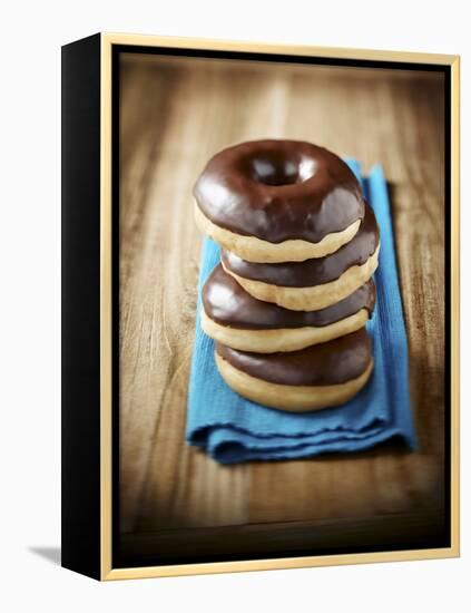 Four Doughnuts with Chocolate Glaze, Stacked-Michael Löffler-Framed Premier Image Canvas