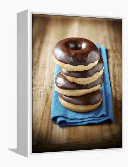 Four Doughnuts with Chocolate Glaze, Stacked-Michael Löffler-Framed Premier Image Canvas