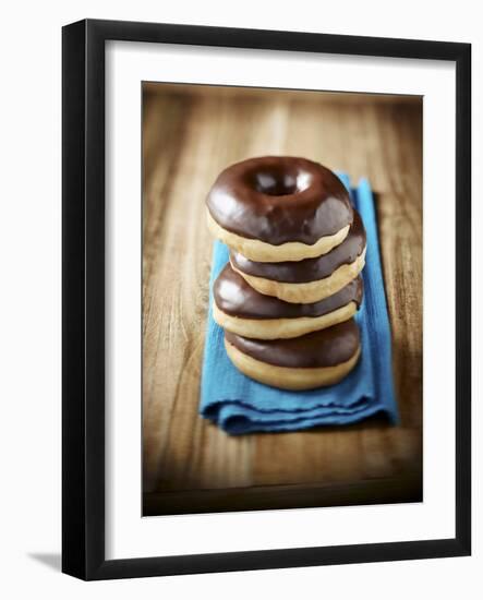 Four Doughnuts with Chocolate Glaze, Stacked-Michael Löffler-Framed Photographic Print