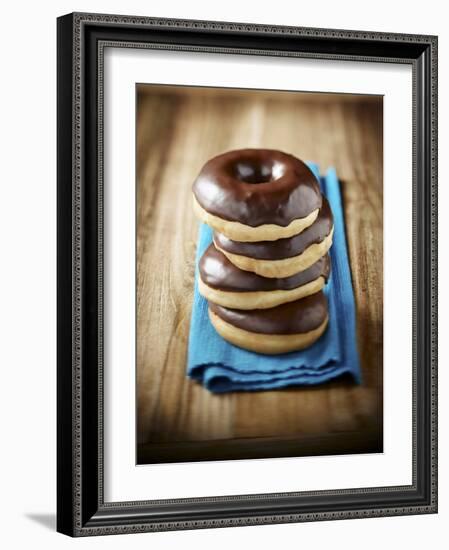 Four Doughnuts with Chocolate Glaze, Stacked-Michael Löffler-Framed Photographic Print