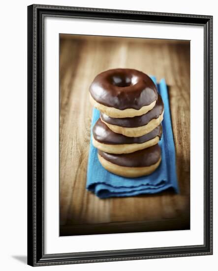 Four Doughnuts with Chocolate Glaze, Stacked-Michael Löffler-Framed Photographic Print