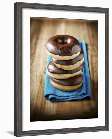 Four Doughnuts with Chocolate Glaze, Stacked-Michael Löffler-Framed Photographic Print