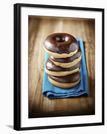 Four Doughnuts with Chocolate Glaze, Stacked-Michael Löffler-Framed Photographic Print