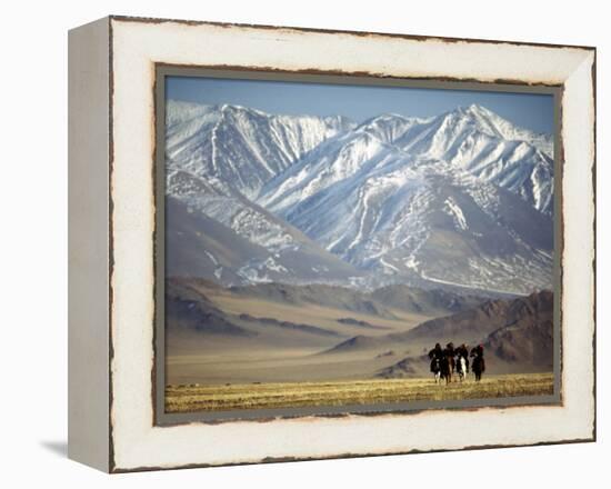 Four Eagle Hunters in Tolbo Sum, Golden Eagle Festival, Mongolia-Amos Nachoum-Framed Premier Image Canvas