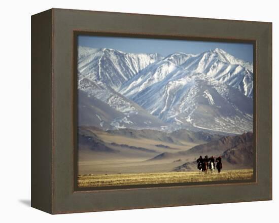 Four Eagle Hunters in Tolbo Sum, Golden Eagle Festival, Mongolia-Amos Nachoum-Framed Premier Image Canvas