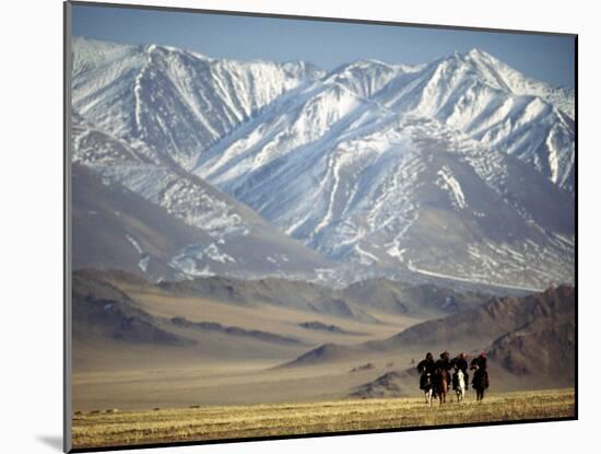 Four Eagle Hunters in Tolbo Sum, Golden Eagle Festival, Mongolia-Amos Nachoum-Mounted Photographic Print