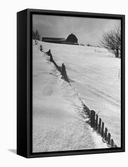 Four Ft. of Snow Almost Covering Up Snow Fence in Front of Barn on the Hill on Upstate Farm-Andreas Feininger-Framed Premier Image Canvas