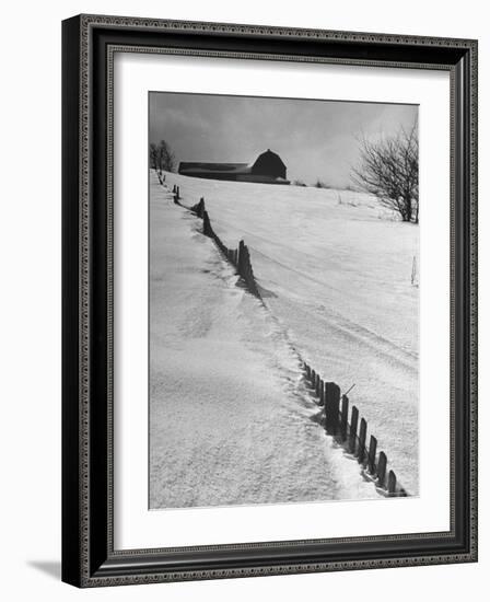 Four Ft. of Snow Almost Covering Up Snow Fence in Front of Barn on the Hill on Upstate Farm-Andreas Feininger-Framed Photographic Print