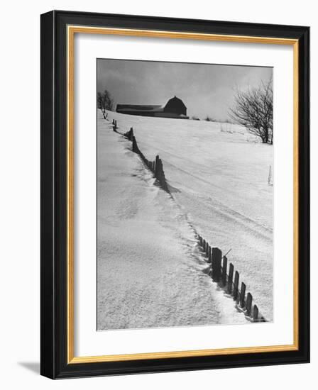 Four Ft. of Snow Almost Covering Up Snow Fence in Front of Barn on the Hill on Upstate Farm-Andreas Feininger-Framed Photographic Print