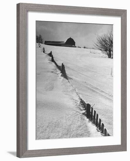 Four Ft. of Snow Almost Covering Up Snow Fence in Front of Barn on the Hill on Upstate Farm-Andreas Feininger-Framed Photographic Print
