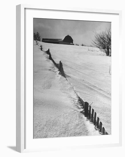 Four Ft. of Snow Almost Covering Up Snow Fence in Front of Barn on the Hill on Upstate Farm-Andreas Feininger-Framed Photographic Print