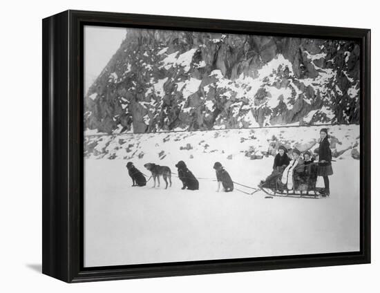 Four Girls on Dog Sled Photograph - Canada-Lantern Press-Framed Stretched Canvas