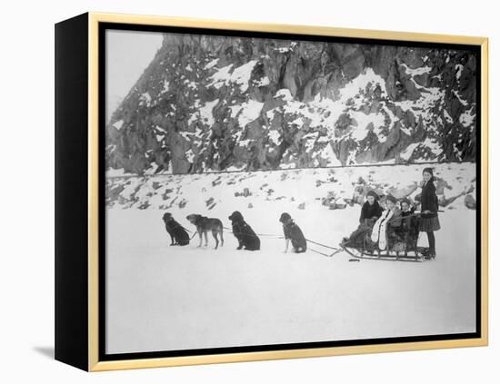 Four Girls on Dog Sled Photograph - Canada-Lantern Press-Framed Stretched Canvas