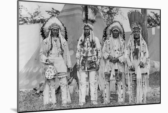 Four Native American Chiefs in Traditional Clothing and Feathered Bonnet-null-Mounted Art Print