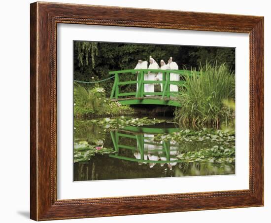 Four Nuns Standing on the Japanese Bridge in the Garden of the Impressionist Painter Claude Monet-David Hughes-Framed Photographic Print