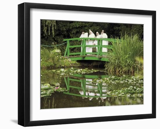 Four Nuns Standing on the Japanese Bridge in the Garden of the Impressionist Painter Claude Monet-David Hughes-Framed Photographic Print