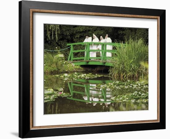 Four Nuns Standing on the Japanese Bridge in the Garden of the Impressionist Painter Claude Monet-David Hughes-Framed Photographic Print