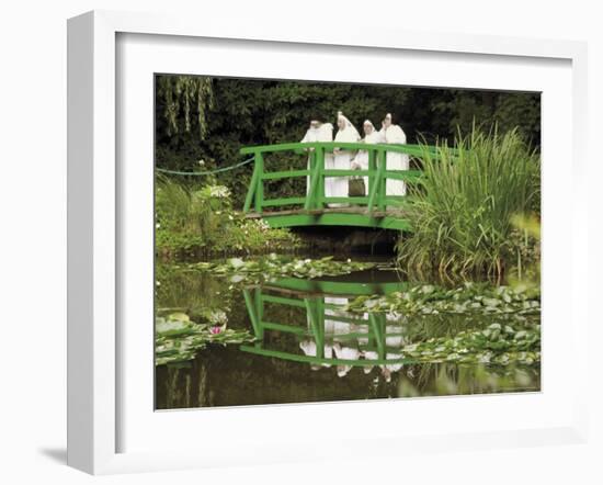 Four Nuns Standing on the Japanese Bridge in the Garden of the Impressionist Painter Claude Monet-David Hughes-Framed Photographic Print