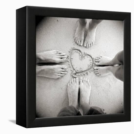 Four Pairs of Feet Standing around a Heart Shape Drawn in Sandy Beach, Taransay, Scotand, UK-Lee Frost-Framed Premier Image Canvas