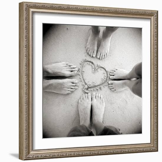 Four Pairs of Feet Standing around a Heart Shape Drawn in Sandy Beach, Taransay, Scotand, UK-Lee Frost-Framed Photographic Print