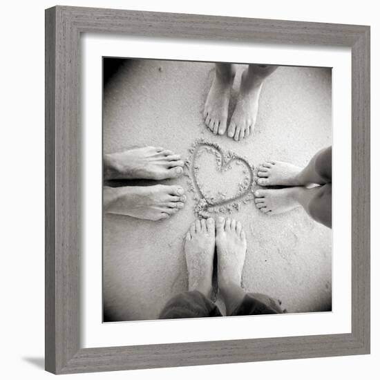 Four Pairs of Feet Standing around a Heart Shape Drawn in Sandy Beach, Taransay, Scotand, UK-Lee Frost-Framed Photographic Print