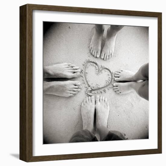 Four Pairs of Feet Standing around a Heart Shape Drawn in Sandy Beach, Taransay, Scotand, UK-Lee Frost-Framed Photographic Print