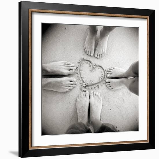 Four Pairs of Feet Standing around a Heart Shape Drawn in Sandy Beach, Taransay, Scotand, UK-Lee Frost-Framed Photographic Print