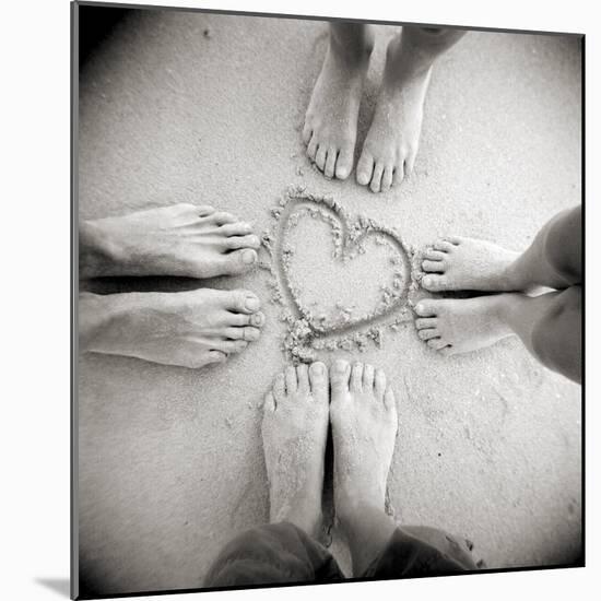 Four Pairs of Feet Standing around a Heart Shape Drawn in Sandy Beach, Taransay, Scotand, UK-Lee Frost-Mounted Photographic Print