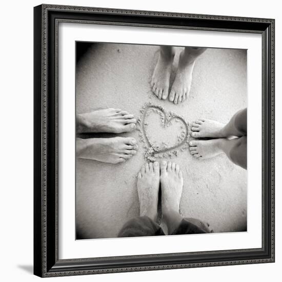 Four Pairs of Feet Standing around a Heart Shape Drawn in Sandy Beach, Taransay, Scotand, UK-Lee Frost-Framed Photographic Print