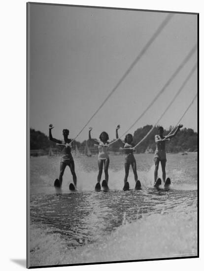 Four People Competing in the National Water Skiing Championship Tournament-Mark Kauffman-Mounted Photographic Print