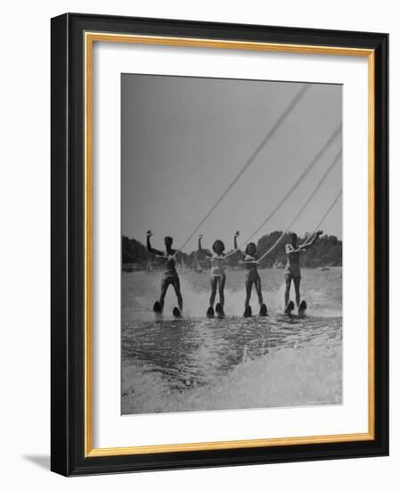 Four People Competing in the National Water Skiing Championship Tournament-Mark Kauffman-Framed Photographic Print