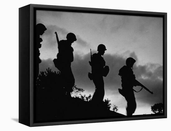 Four Soldiers with Helmets and Rifles Moving on Crest of Ridge, on Patrol at Night-Michael Rougier-Framed Premier Image Canvas