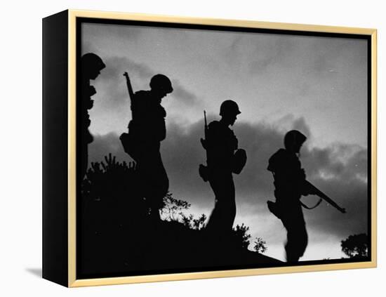 Four Soldiers with Helmets and Rifles Moving on Crest of Ridge, on Patrol at Night-Michael Rougier-Framed Premier Image Canvas